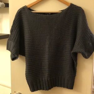 Sweater- it’s a blue/grey shade.